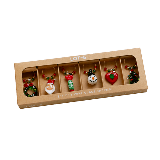 Set of 5 Christmas-themed wine glass charms in a cardboard box on a white background