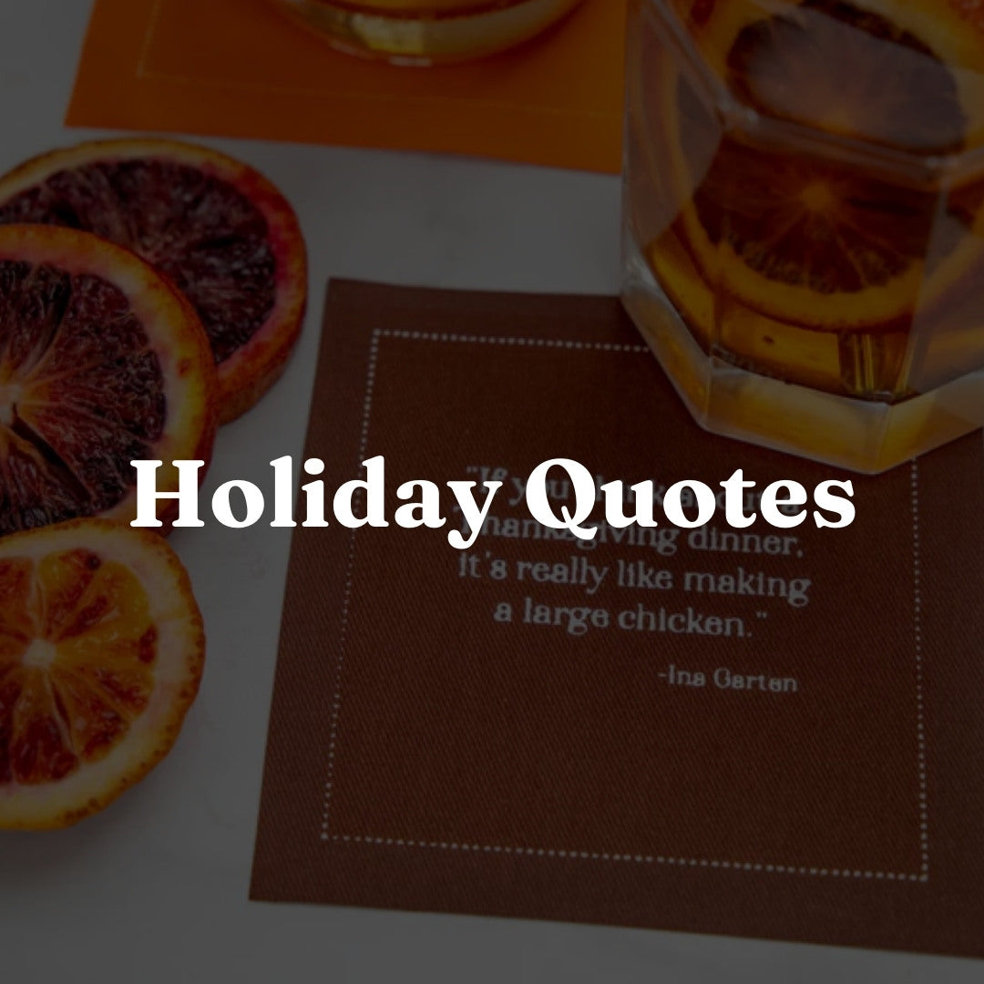 The image shows a martini glass with a clear liquid, likely a martini, garnished with three olives on a toothpick. It’s on a dark table with a white napkin underneath. The dimly lit background highlights the drink as the main focus.