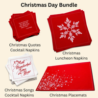Christmas Day Bundle of organic cotton napkins and placemats in red and white, including quote and song printed cocktail napkins, snowflake luncheon napkins, and snowflake placemats.