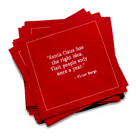 Stack of organic cotton cocktail napkins in Toreador color with quote 'Santa Claus has the right idea. Visit people only once a year.'
