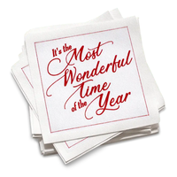 Stack of organic cotton napkins with red script quote 'It's the Most Wonderful Time of the Year'.