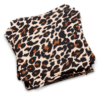 Stack of organic cotton napkins with leopard print pattern, square folded