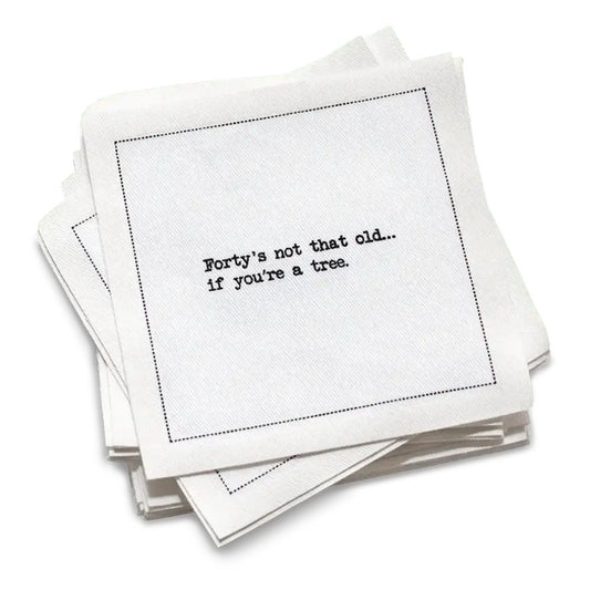 Organic cotton cocktail napkin with black dotted border printed with the quote "Forty's not that old... if you're a tree," from Five Star Napkins' 40th birthday quote collection