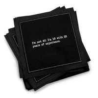 Organic cotton cocktail napkin, black, with white dotted border printed with the quote "I'm not 40. I'm 18 with 22 years of experience," from Five Star Napkins' 40th birthday quote collection