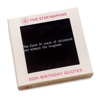 Kraft gift box from Five Star Napkins' 50th Birthday Quotes collection, showing an organic cotton cocktail napkin, black, printed with the quote "The first 50 years of childhood are always the toughest"