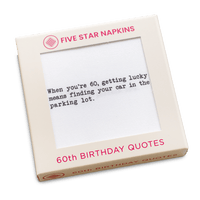 Kraft gift box from Five Star Napkins' 60th Birthday Quotes collection, showing an organic cotton cocktail napkin printed with the quote "When you're 60, getting lucky means finding your car in the parking lot"