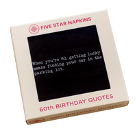 Kraft gift box from Five Star Napkins' 60th Birthday Quotes collection, showing an organic cotton cocktail napkin, black, printed with the quote "When you're 60, getting lucky means finding your car in the parking lot"