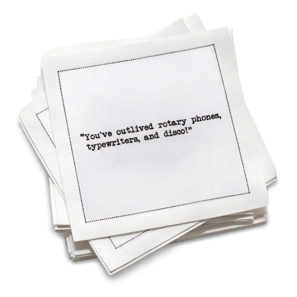 Stack of white cotton cocktail napkins with black text on a white background | Five Star Napkins' 75th birthday quote collection