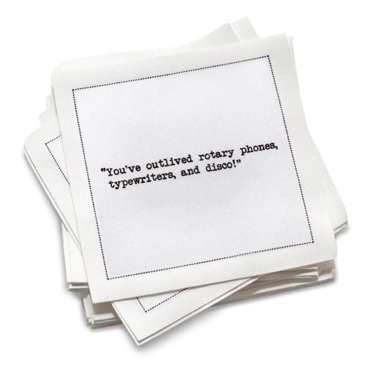 Stack of white cotton cocktail napkins with black text on a white background | Five Star Napkins' 75th birthday quote collection