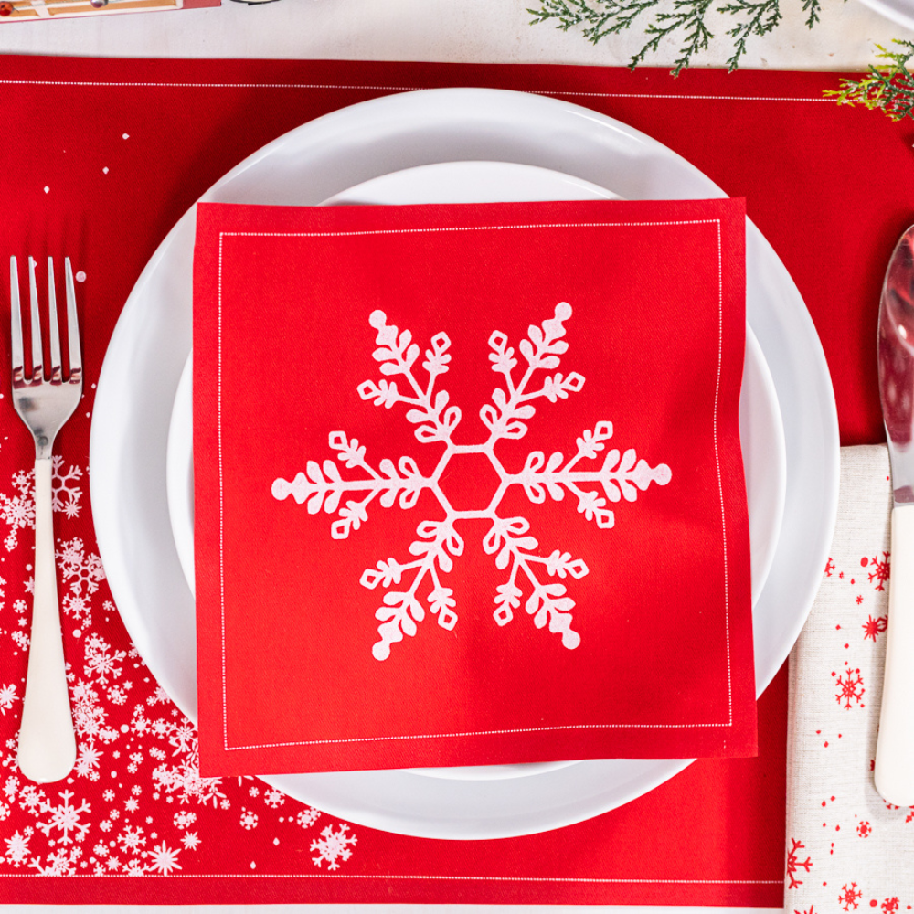 Organic cotton napkin in Toreador with white snowflake design on holiday table setting