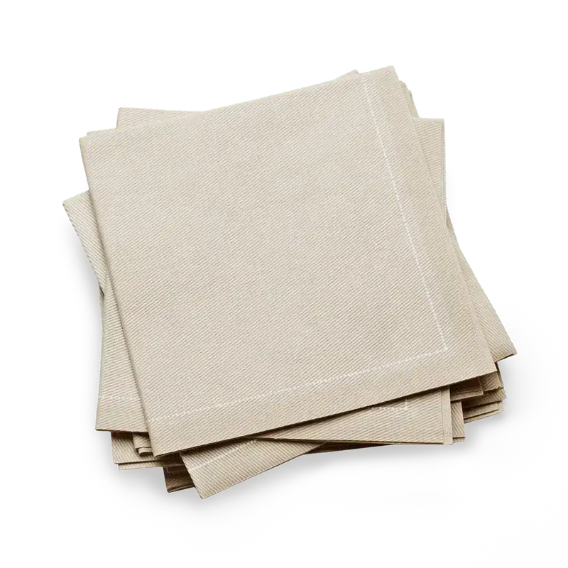 Sand-colored organic cotton cocktail napkins from Five Star Napkins, neatly stacked