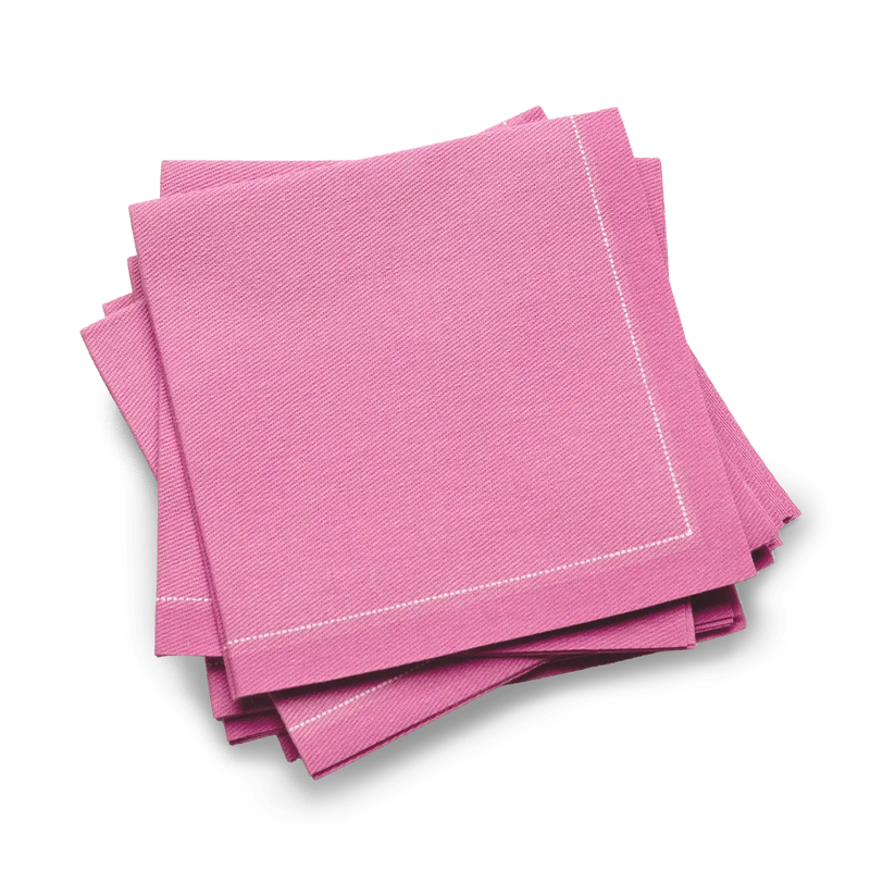 Stack of pink organic cotton luxury cocktail napkins with stitched border