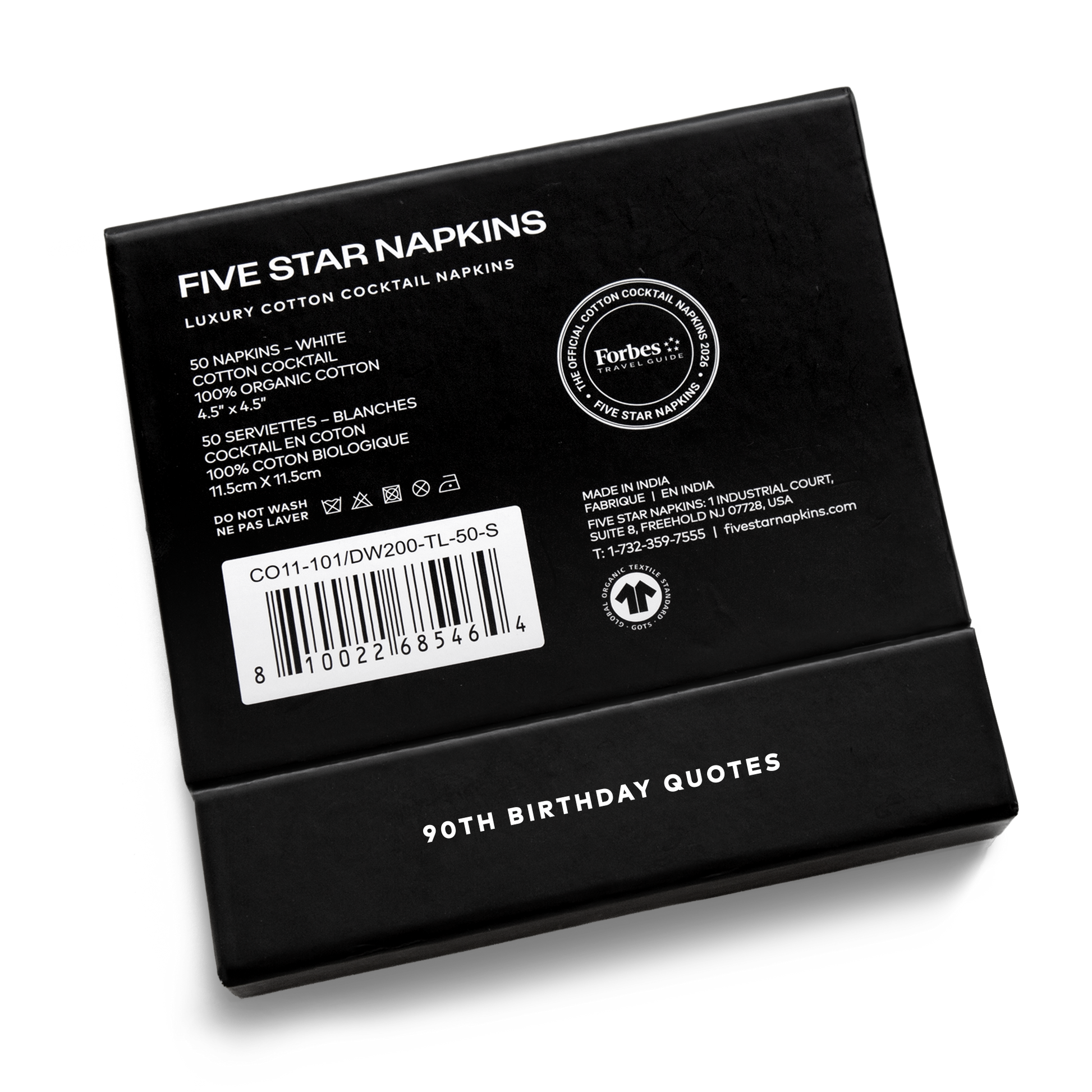 Back of the black gift box from Five Star Napkins' 90th birthday quote collection, showing organic cotton cocktail napkin product details and the Forbes Travel Guide seal