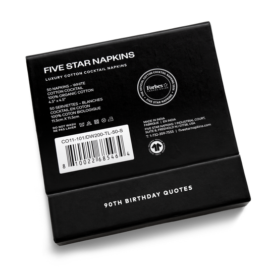 Back of the black gift box from Five Star Napkins' 90th birthday quote collection, showing organic cotton cocktail napkin product details and the Forbes Travel Guide seal