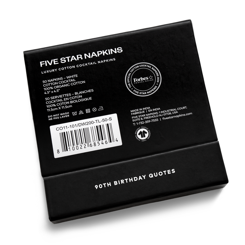 Back of the black gift box from Five Star Napkins' 90th birthday quote collection, showing organic cotton cocktail napkin product details and the Forbes Travel Guide seal