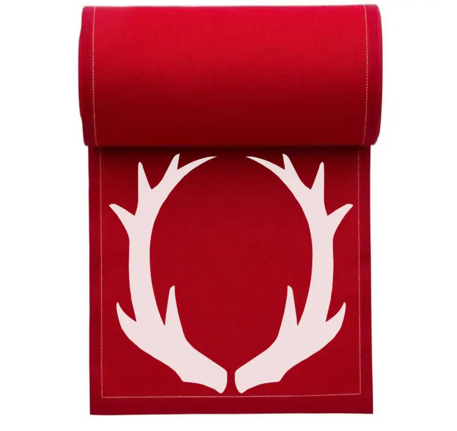 rolled organic cotton table runner in Toreador with white antler design