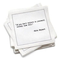 Stack of white cards with a motivational quote by Kobe Bryant on a white background