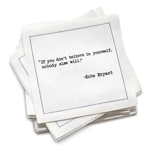 Stack of white cards with a motivational quote by Kobe Bryant on a white background