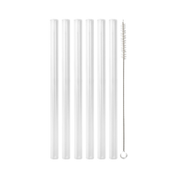 Six clear glass straws and one cleaning brush on black background