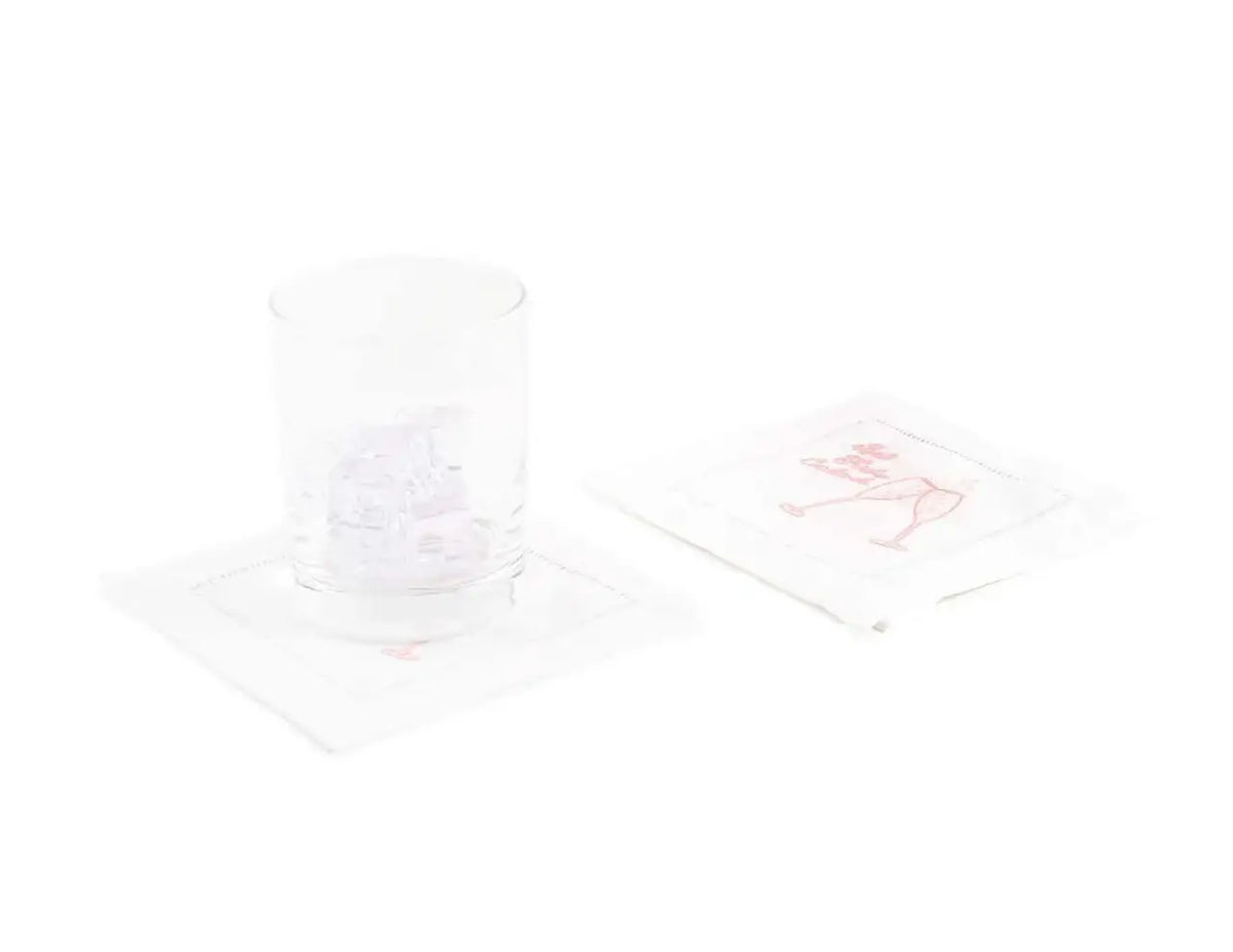 Organic cotton cocktail napkins with pink cocktail glass print, glass with ice on one napkin