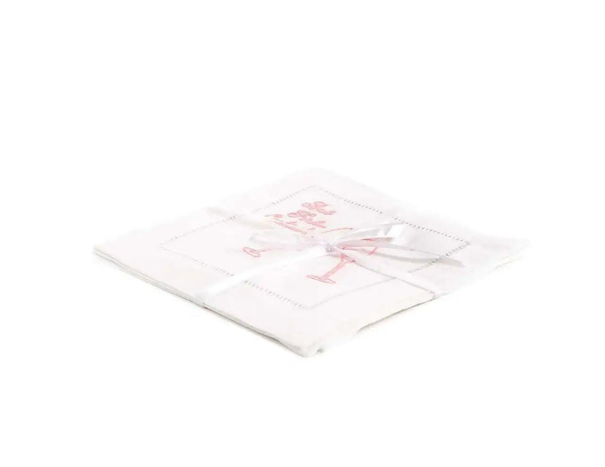 Pack of organic cotton cocktail napkins with pink cocktail glass and legible quote, tied with ribbon.