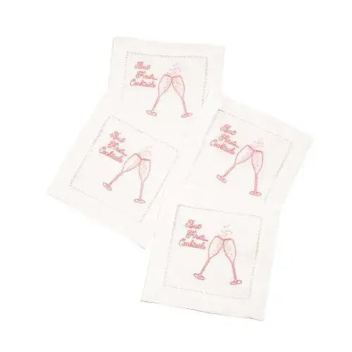 Set of four organic cotton cocktail napkins with pink glasses and 'but first, cocktails' quote