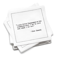 Organic cotton cocktail napkin with black dotted border printed with the Coco Chanel quote "I only drink Champagne on two occasions, when I am in love and when I am not," from Five Star Napkins' Champagne quote collection