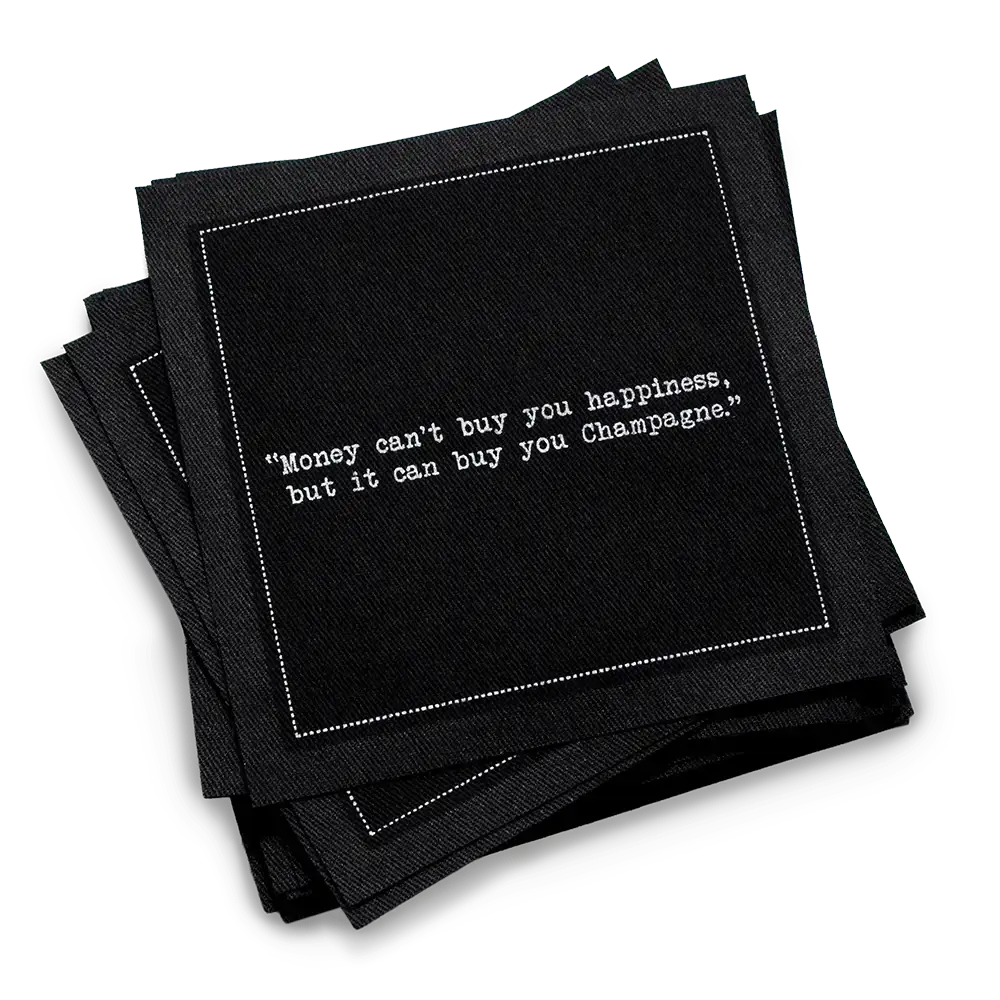 Organic cotton cocktail napkin, black, with white dotted border printed with the quote "Money can't buy you happiness, but it can buy you Champagne," from Five Star Napkins' Champagne quote collection