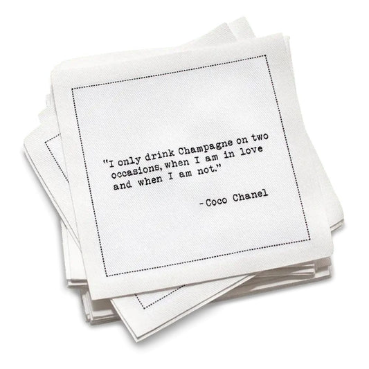 Organic cotton cocktail napkin, white, with black dotted border printed with the quote "Money can't buy you happiness, but it can buy you Champagne," from Five Star Napkins' Champagne quote collection