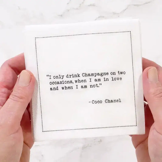 Video of a hand holding an organic cotton cocktail napkin printed with the Coco Chanel quote "I only drink Champagne on two occasions, when I am in love and when I am not," from Five Star Napkins' Champagne quote collection