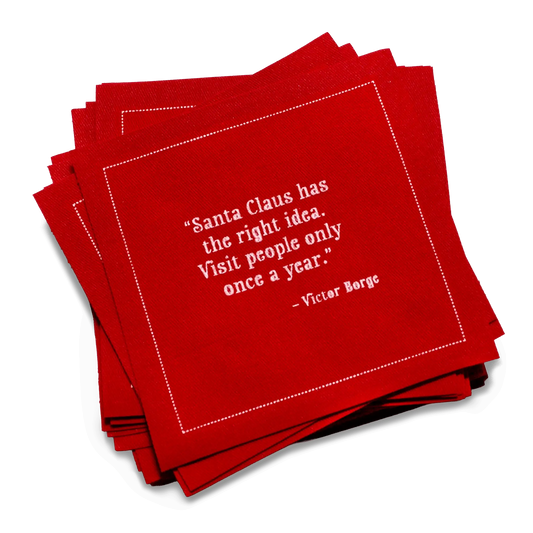 Stack of red organic cotton cocktail napkins printed with the quote, “I’m dreaming of a white Christmas. But, if the white runs out I’ll drink the red.” – Author Unknown.
