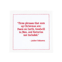organic cotton napkin with red quote text: 'Three phrases that sum up Christmas are: Peace on Earth, Goodwill to Men, and Batteries not Included.'