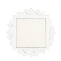 Fanned stack of ecru organic cotton cocktail napkins, by Five Star Napkins.