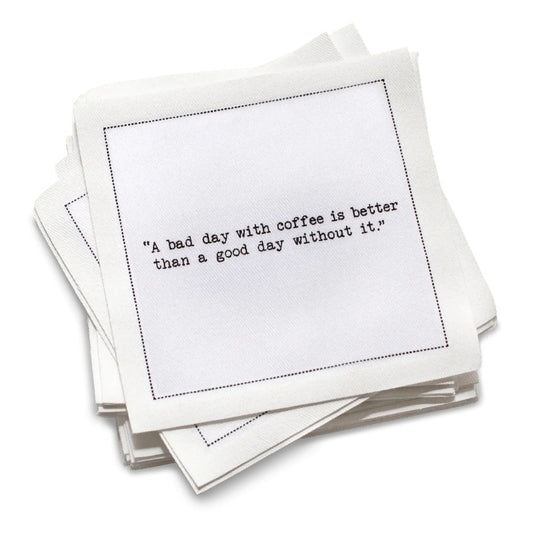  Five Star Napkins' Coffee Quotes quote collection, showing an organic cotton cocktail napkin printed with the quote "A bad day with coffee is better than a good day without it"