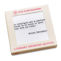 A cream-colored Five Star Napkins box labeled “Literary Drinking Quotes,” with a window showing a white napkin printed with the Ernest Hemingway quote, “An intelligent man is sometimes forced to be drunk to spend time with his fools.”