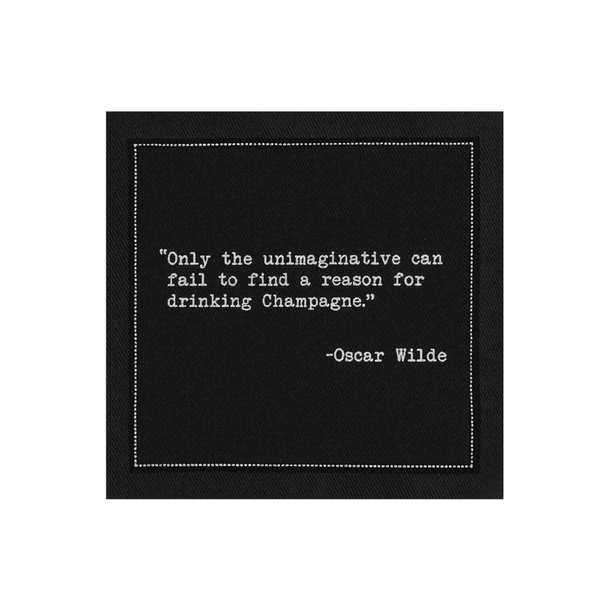 Black cocktail napkin from The Drinking Quotes Second Edition, printed with white typewriter-style text reading, “Only the unimaginative can fail to find a reason for drinking Champagne.” – Oscar Wilde.