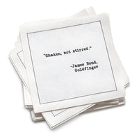 Organic cotton cocktail napkin with black dotted border printed with the quote "Shaken, not stirred," from Five Star Napkins' Drinking Quotes Second Edition collection