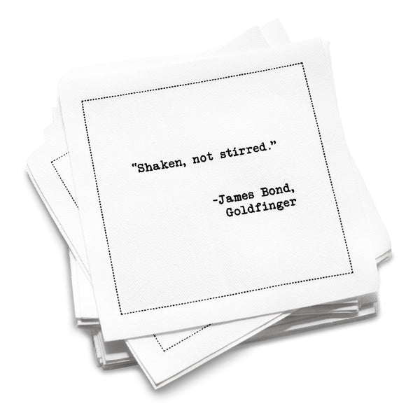 White cotton cocktail napkin reading Shaken, not stirred
