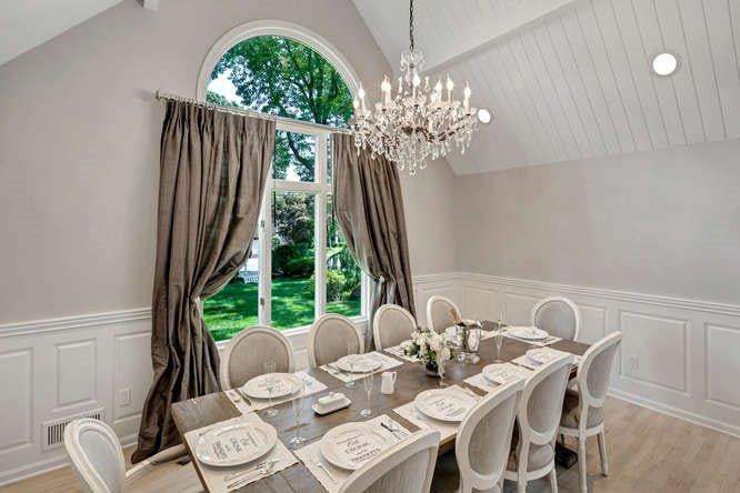 Elegant dining room table set for entertaining with organic cotton placemats featuring printed quotes.