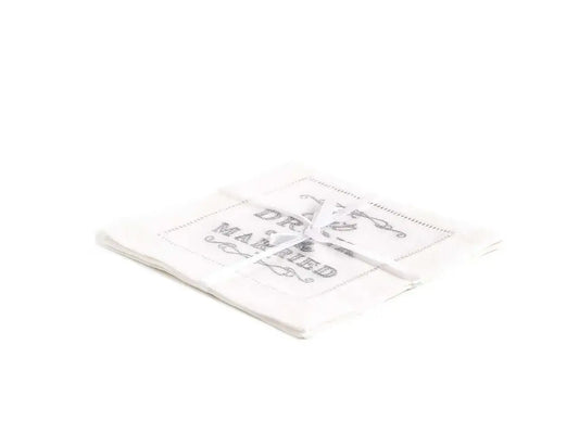 Pack of folded organic cotton napkins featuring the printed quote 'Eat Drink Married', tied with ribbon.