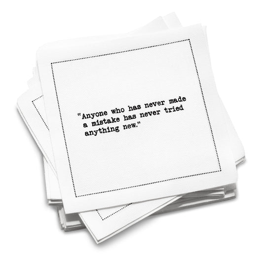 Organic cotton cocktail napkin with black dotted border printed with the quote "Anyone who has never made a mistake has never tried anything new," from Five Star Napkins' Einstein quote collection