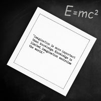 Organic cotton cocktail napkin printed with the quote "Imagination is more important than knowledge. Knowledge is limited. Imagination encircles the world," styled on a chalkboard with the equation E=mc² written above, from Five Star Napkins' Einstein quote collection