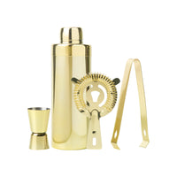 Gold stainless steel cocktail shaker, jigger, strainer, and ice tongs on a white background, by Five Star Napkins.