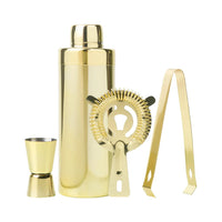 Gold stainless steel cocktail shaker set including a shaker, jigger, strainer, and ice tongs, by Five Star Napkins.