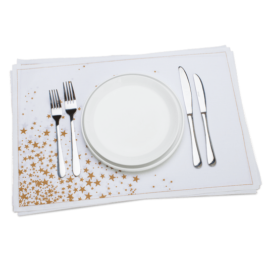 White cotton placemat with gold stars set with plate, forks, and knives, luxury table decor