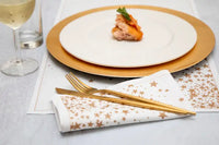 Organic cotton napkin and placemat with gold star pattern at a formal place setting