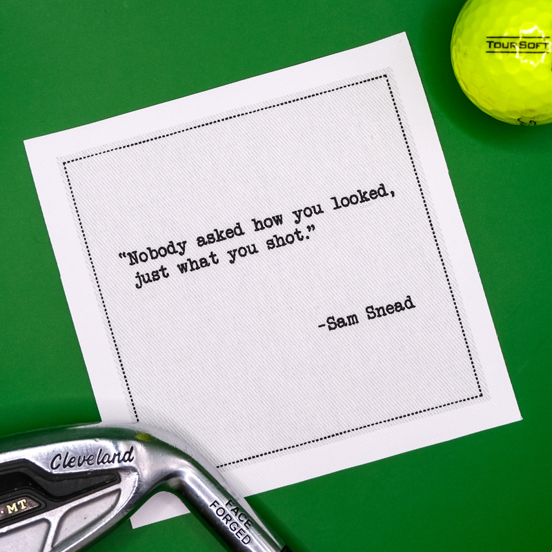 Organic cotton cocktail napkin with Sam Snead golf quote, golf ball, and club on green