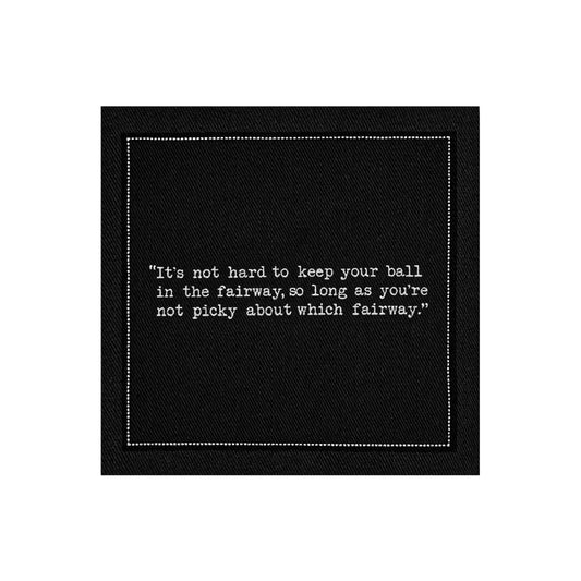 Anthracite Grey organic cotton napkin featuring golf humor quote: 'It's not hard to keep your ball in the fairway, so long as you're not picky about which fairway.'
