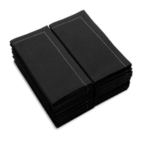 Stack of folded Anthracite Grey organic cotton napkins with textured pattern