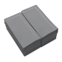 Stack of folded Anthracite Grey organic cotton napkins with textured pattern